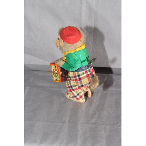 20 - Post War West German clockwork tinplate Monkey playing Barrel Organ.   Excellent clockwork motor wor... 