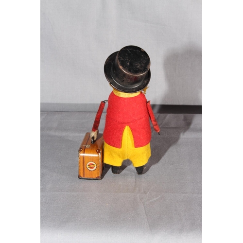 21 - Schuco clockwork Monkey with Suitcase.   Original clothes.  Excellent clockwork motor works.