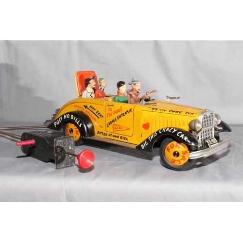 36 - Arnold West Germany tinplate Tin Lizzy Cabriolet.   Missing screen, complete with four composite fig... 