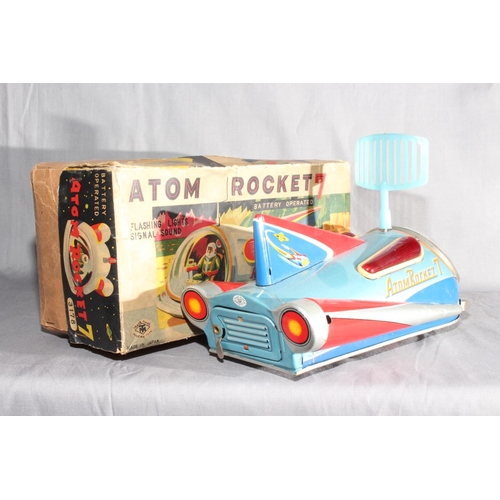 57 - TM Toys (Masudaya) battery operated tinplate Atom Rocket 7.   Excellent with minor wear in Good orig... 