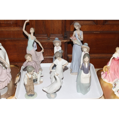 19 - Nine Nao lady, boys, girls and swan figures.