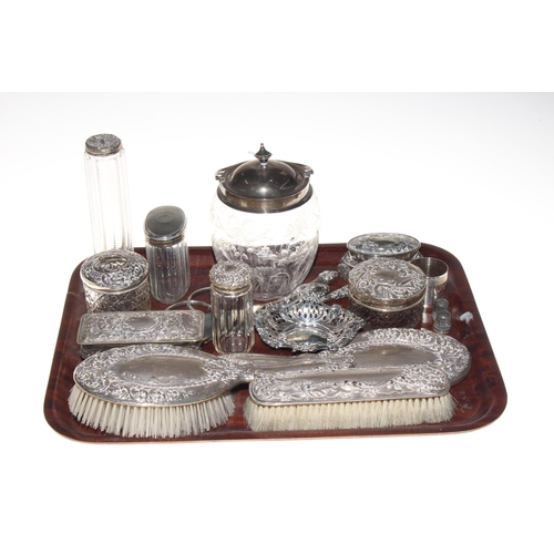 2 - Silver wares comprising embossed brush set, seven silver topped toilet bottle, bon bon dish, biscuit... 