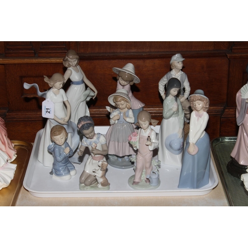 21 - Two Lladro girl figures and eight Nao figures.