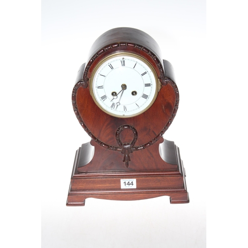 144 - Mahogany balloon shaped mantel clock, 34cm high.