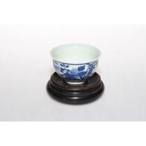 165 - Chinese blue and white tea bowl with six character mark, 7.5cm diameter, with stand.