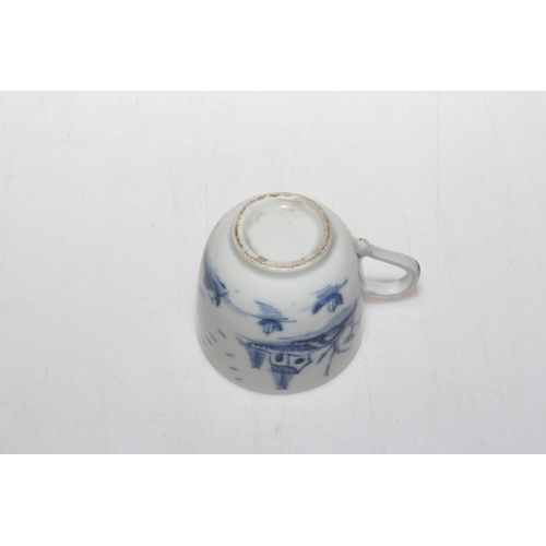 172 - 19th Century Oriental pottery blue and white cup decorated with trees and flowers.