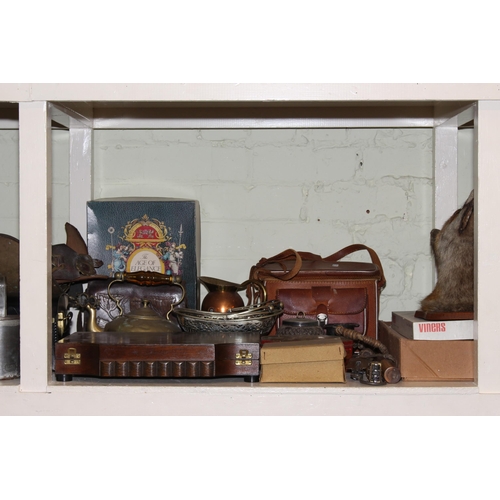 91 - Full shelf of collectables including slate mantel clock, copper and brass coal scuttles, metalwares,... 