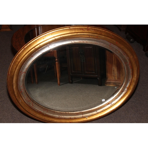 96 - Oval bevelled gilt framed mirror and collection of crystal and other glass.