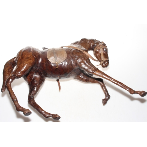 139 - Leather tang horse, 33cm high.