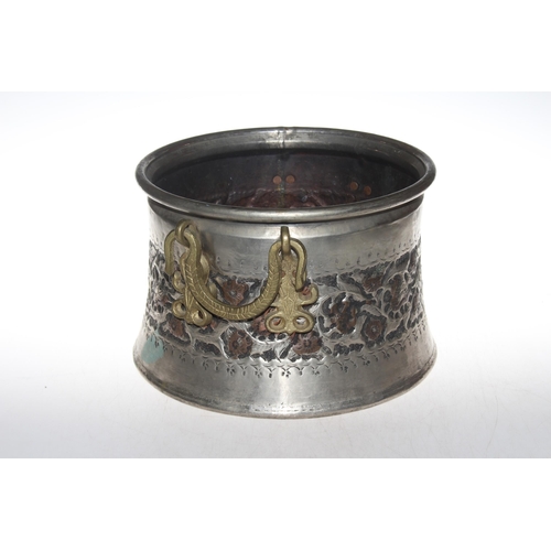 142 - Antique Eastern Persian silver and copper two handled bowl, 21cm high.