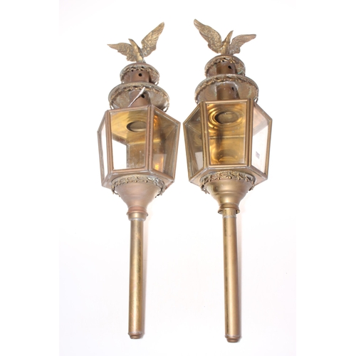 145 - Pair of eagle lamps, 78cm length.