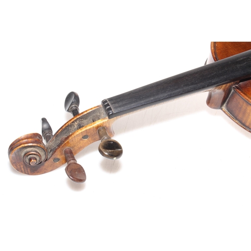 158 - Antique mahogany violin with leather case.