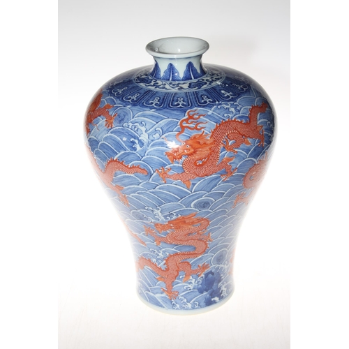 174 - Large Chinese red dragon vase with continuous decoration on sea scroll ground, 34cm, blue mark to ba... 