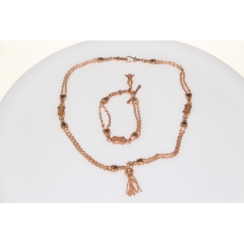 194 - 9ct Rose gold ornate necklace and bracelet in watch albert style.