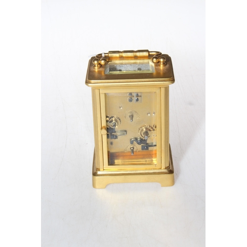 223 - French matt gilt brass carriage clock with alarm movement, 14.5cm to top of handle.