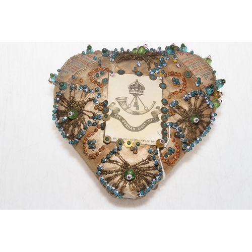 227 - War time 'Think of Me' heart shaped pin cushion with DLI card, and pair brass mounted horseshoes.