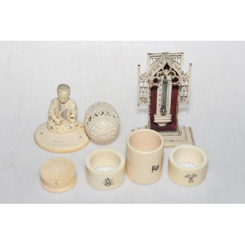 242 - Box of old ivory and bone items including thermometer, egg box, figure, napkin rings, etc.