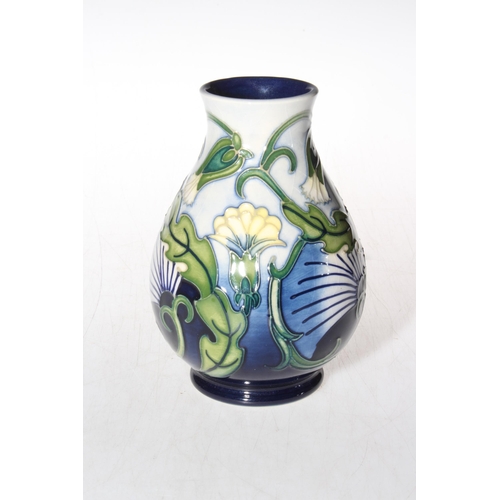 288 - Moorcroft vase with stylised foliage decoration, bearing artists signature, 13.5cm, boxed.