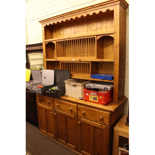 347 - Pine shelf and hutch back three door dresser, 222cm by 159cm by 54cm.