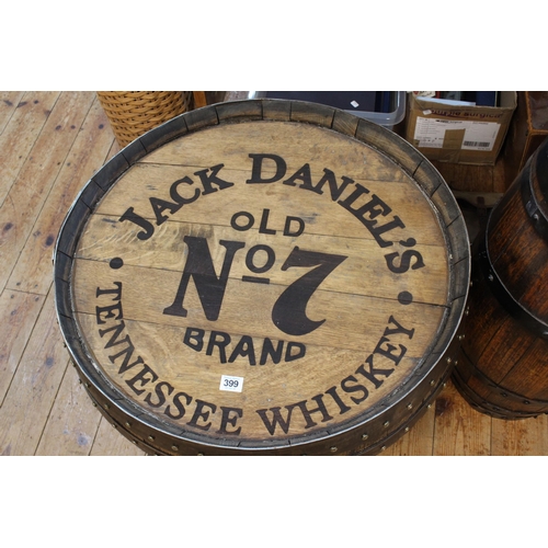 399 - 'Jack Daniels' barrel topped low table, 47cm by 63cm diameter.