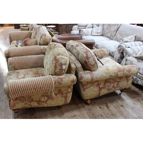 404 - Four piece lounge suite comprising large two seater settee and three armchairs in floral pattern fab... 