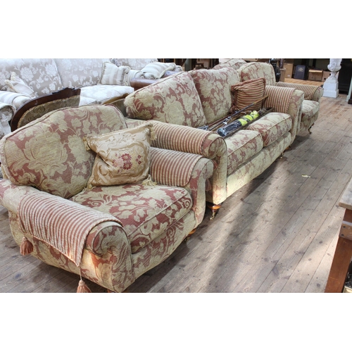 404 - Four piece lounge suite comprising large two seater settee and three armchairs in floral pattern fab... 