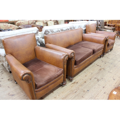 410 - 1920's/30's tan hide and studded three piece lounge suite.