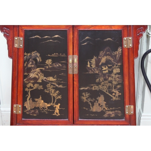 411 - Oriental style black lacquer and gilt painted panel door altar cabinet, 93cm by 82cm by 38cm.