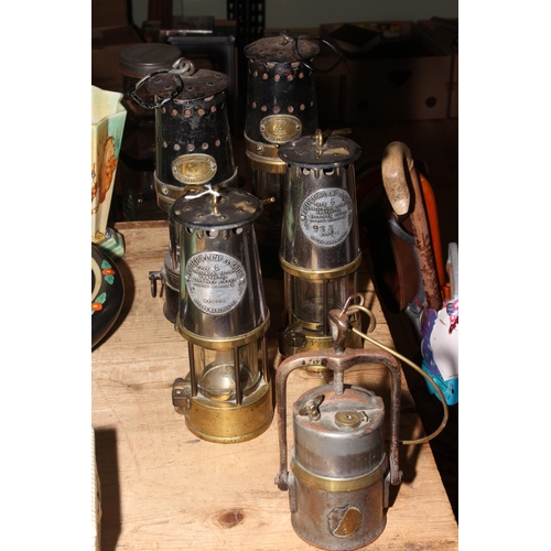 42 - Pair of Patterson and pair of Protector Lamp and Lighting Co. miners lamps and another lamp.