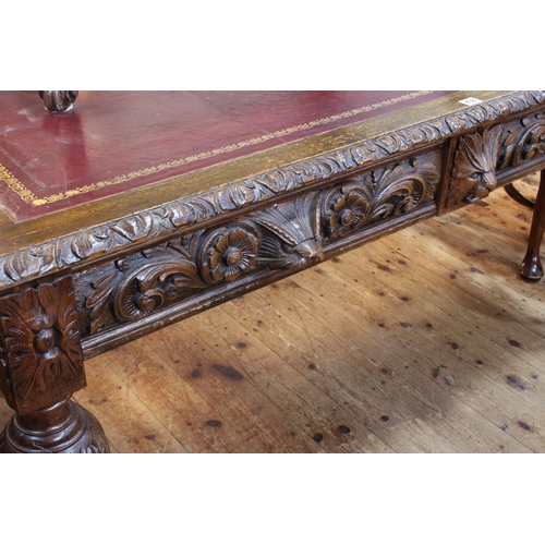 438 - Victorian carved oak two drawer library table, 76cm by 152cm by 89cm.