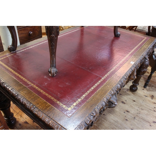 438 - Victorian carved oak two drawer library table, 76cm by 152cm by 89cm.