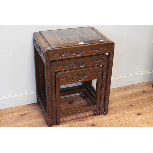 462 - Nest of three Oriental carved hardwood tables (largest 57cm by 44cm by 32cm).