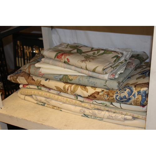 109 - Collection of assorted linens of varying lengths and widths including John Lewis print, wood print b... 