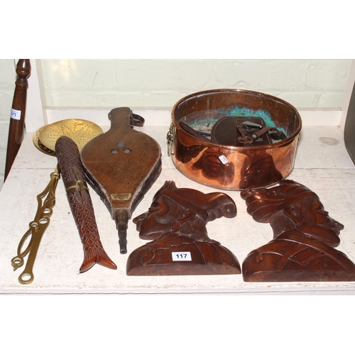 117 - Brass and copper two handled pot, bellows, carved wooden plaques, bed pan, etc.