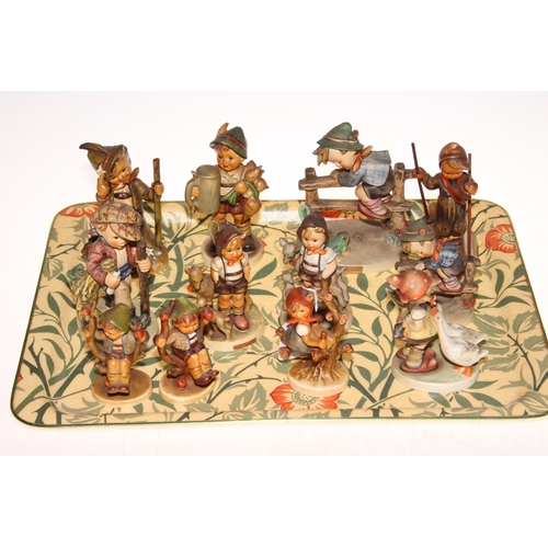 12 - Collection of twelve Hummel figures including Skier, Apple Tree Boy & Girl, two Little Goat Herders ... 