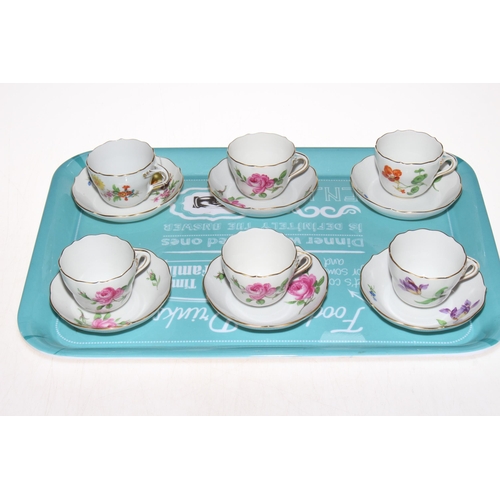 14 - Set of six Meissen cabinet cups and saucers, each with floral designs.