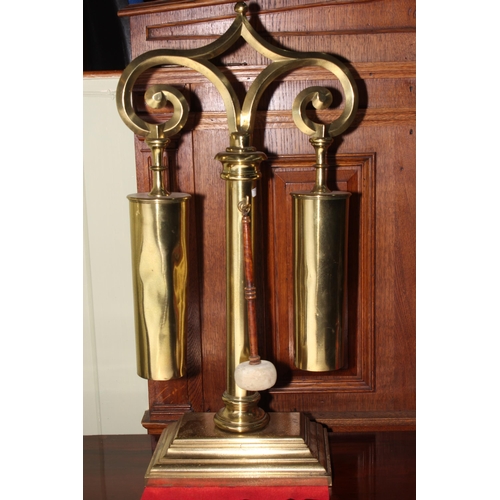 195 - Brass dinner gong, 78cm high.