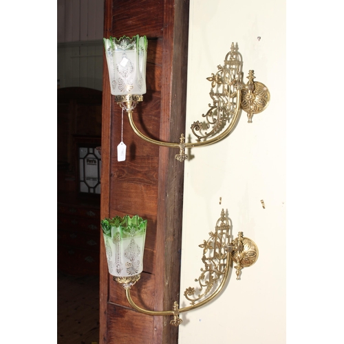 196 - Pair of ornate brass wall lights with green tinted etched glass shades.