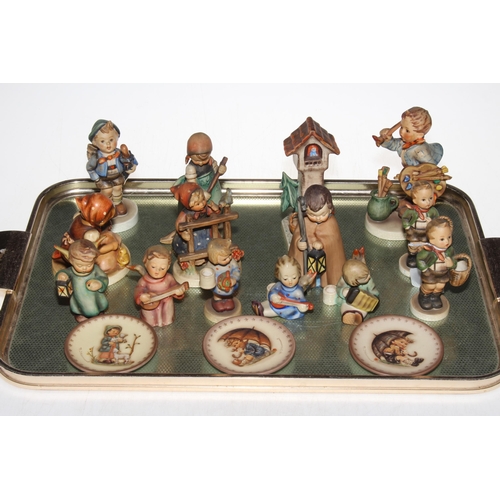 23 - Collection of fourteen Hummel figures and three small plates.