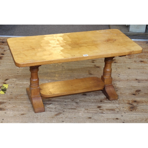 554 - Rectangular oak adzed cut coffee table with cat motif, 43cm by 88cm by 42.5cm.