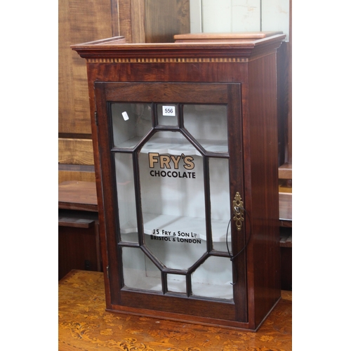 556 - Small astragal glazed display cabinet marked Frys Chocolate, 68cm by 45cm by 23.5cm.