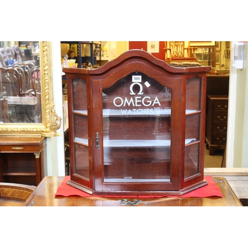 560 - Arched top glazed door wall cabinet with canted corners marked Omega Watches, 52.5cm by 55.5cm by 14... 