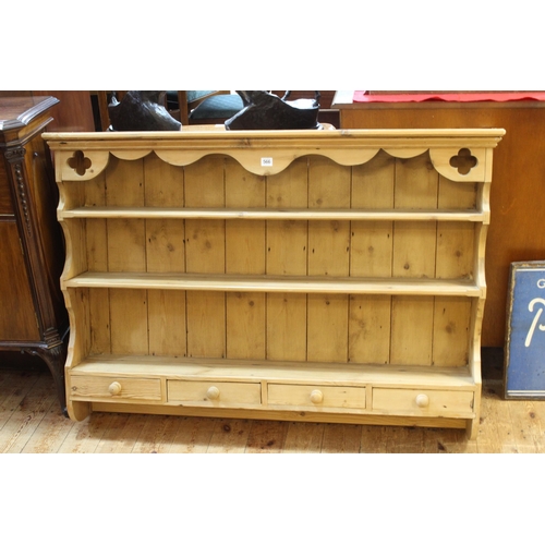 566 - Pine wall rack with four small drawers, 91cm by 128cm by 22cm.