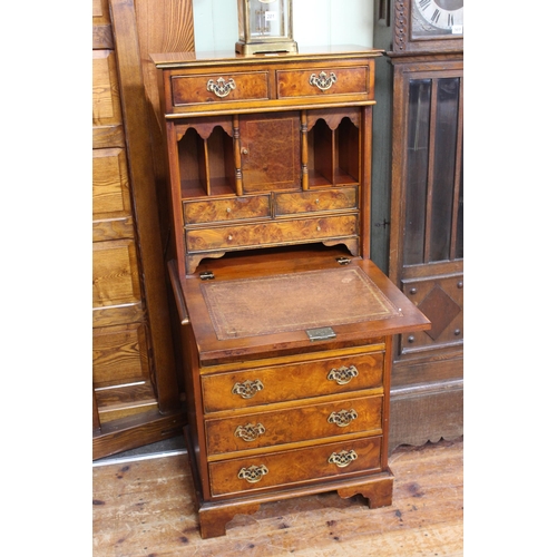 570 - Burr walnut secretaire having two small drawers above a fall front enclosing well fitted interior wi... 