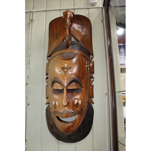 152 - Large carved inlaid Zambian wall mask.