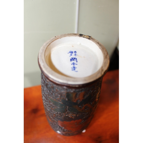 160 - Pair Japanese vases with flat relief blossom and butterfly decoration, blue character marks, 23.5cm.