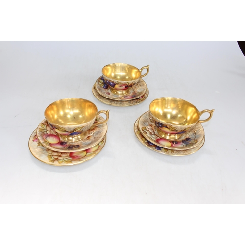 34 - Aynsley Orchard Gold tea china including teapot, small tazza and dishes, bearing D. Jones and N. Bru... 