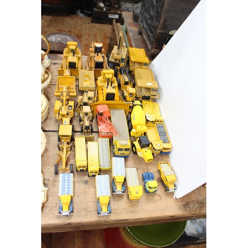 35 - Collection of NZG, Conrad and other excavating commercial model vehicles including Blue Circle Cemen... 