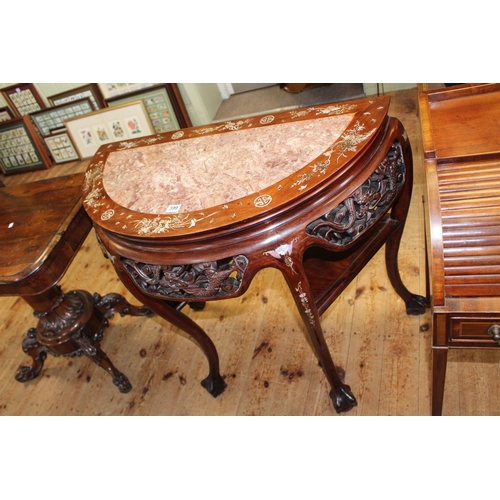 399 - Oriental hardwood and mother of pearl inlaid demi-lune table with marble inset top on ball and claw ... 