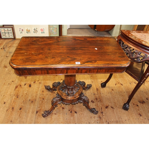 400 - Victorian rosewood fold top tea table on turned pedestal to four carved scrolled legs, 74cm by 92cm ... 